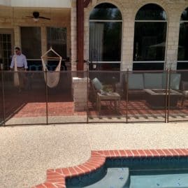 home owner admiring new pool fence