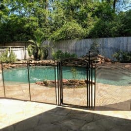 swimming safely behind pool fence