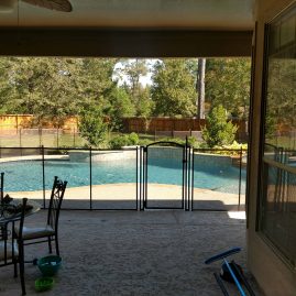 swim pool with man-high safety fence