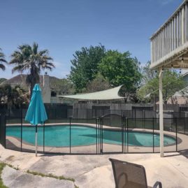 safety pool fence surrounding a pool